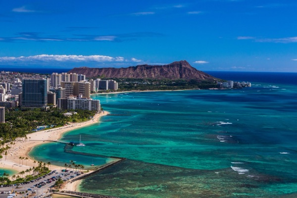 Waikīkī Beach and its hotels, with Lēʻahi (Diamond Head) beyond