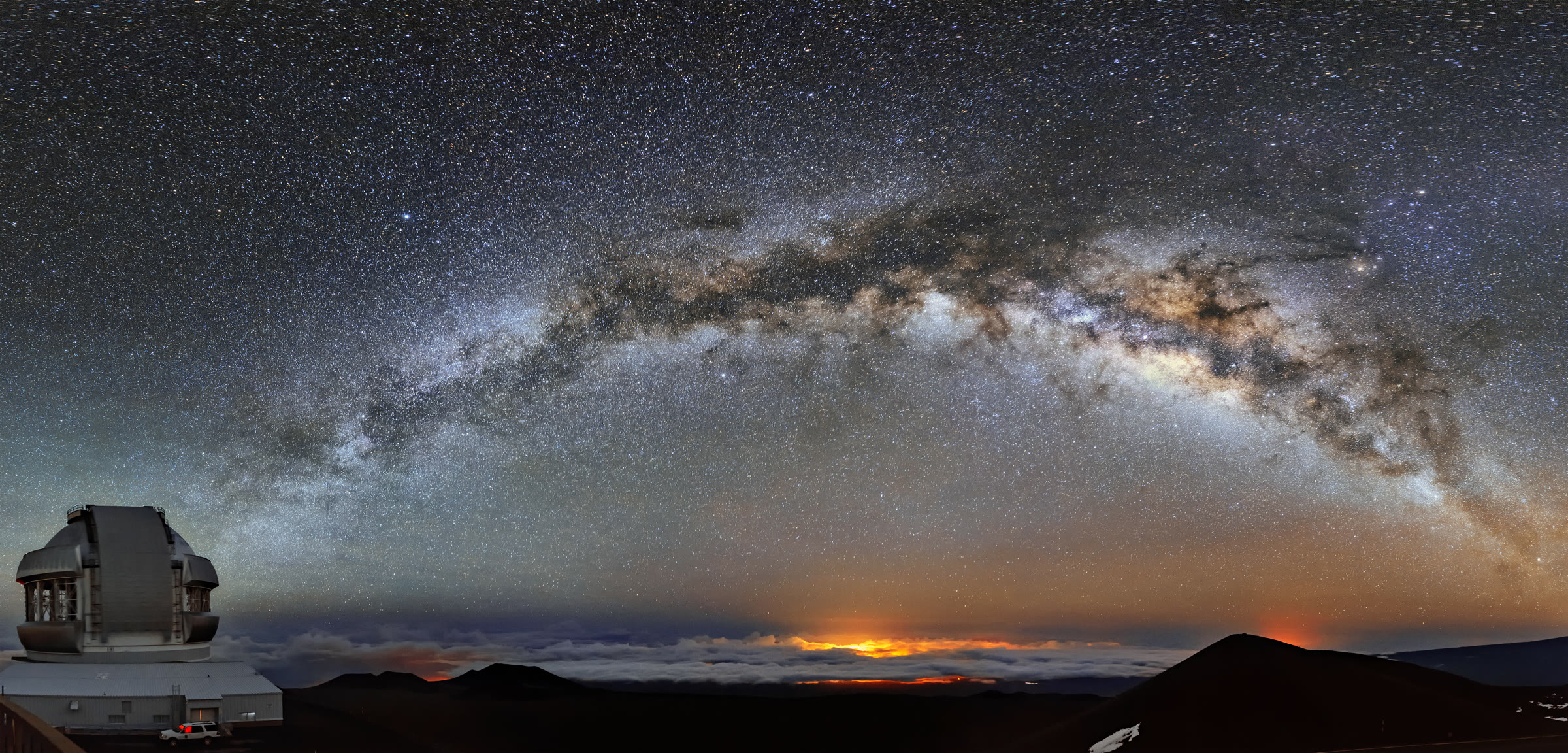 Milky Way arching over Maunakea with Gemini North under a sea of clouds