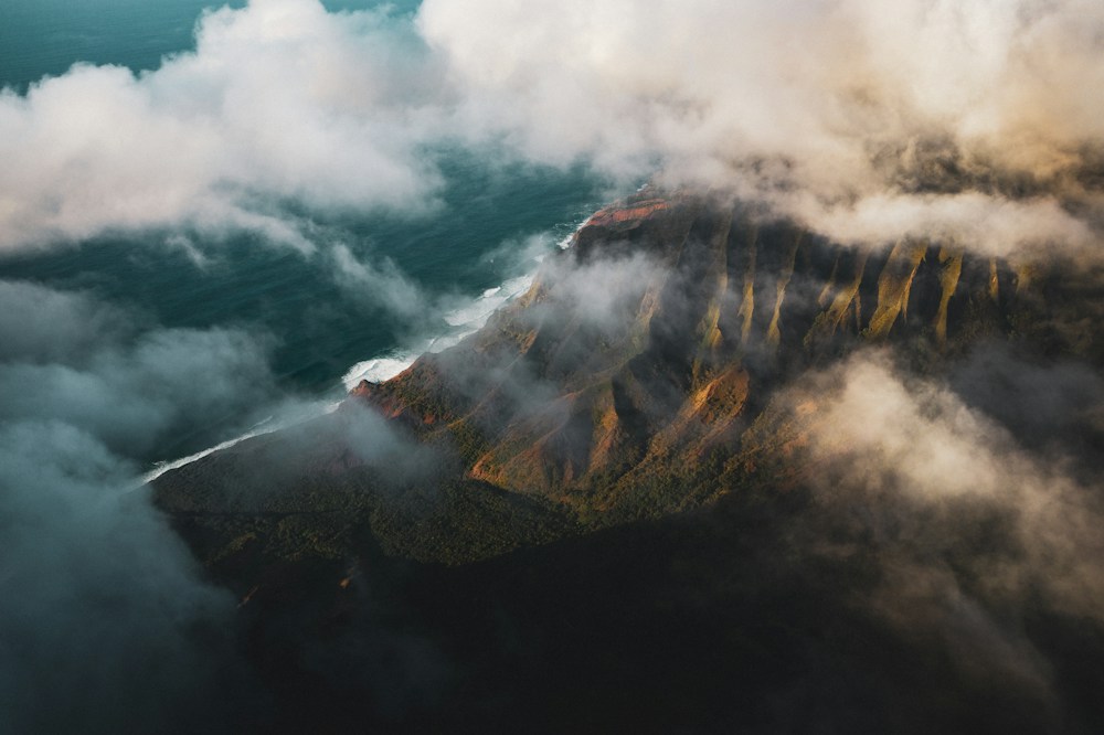 Clouds drifting across Kauaʻi’s rugged western cliffs