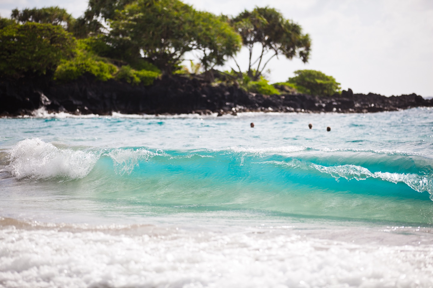 Wave crashing on shore of Hamoa Beach, Hana, Maui